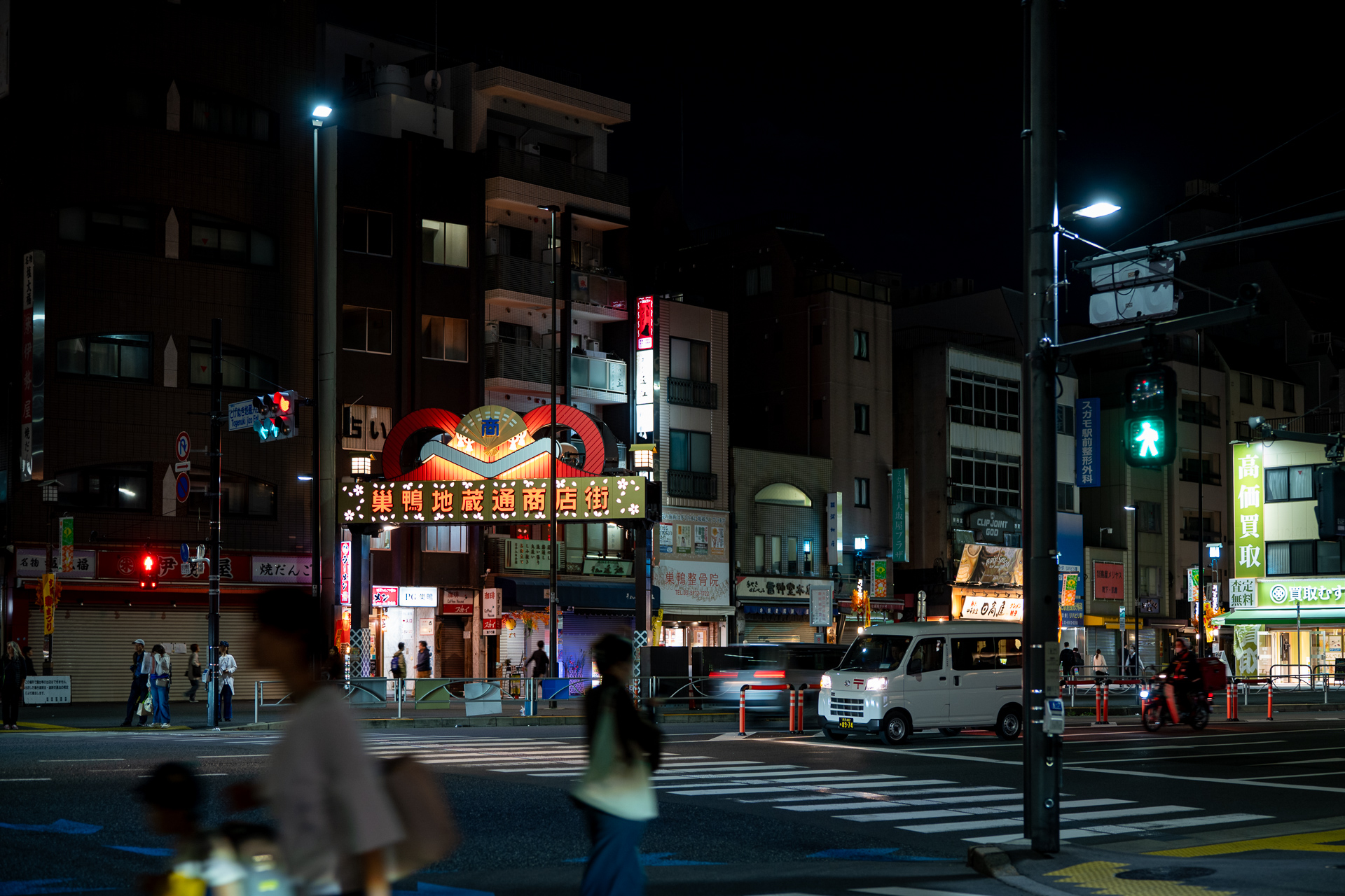 A crowded street in Japan at night, managed by a Destination Management Organization